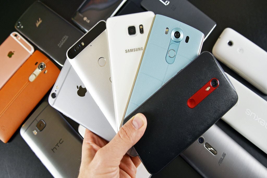 holding phones in hand