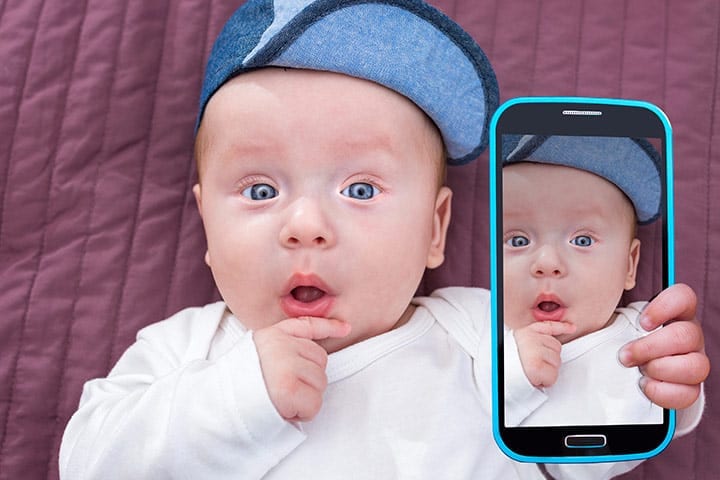 baby holding phone