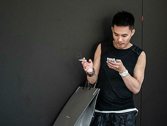 smoking while holding phone