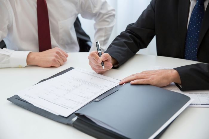 signing a deal co worker