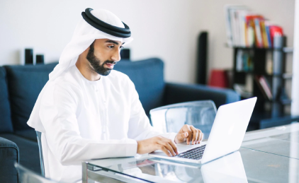 Gulf Man work on Laptop