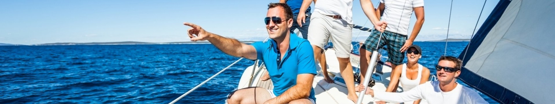 A group of friends on a sailboat for a stag do