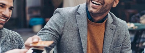 A group of lads on a stag do paying for drinks