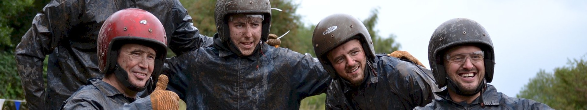 Stag Party covered in mud on rage buggy