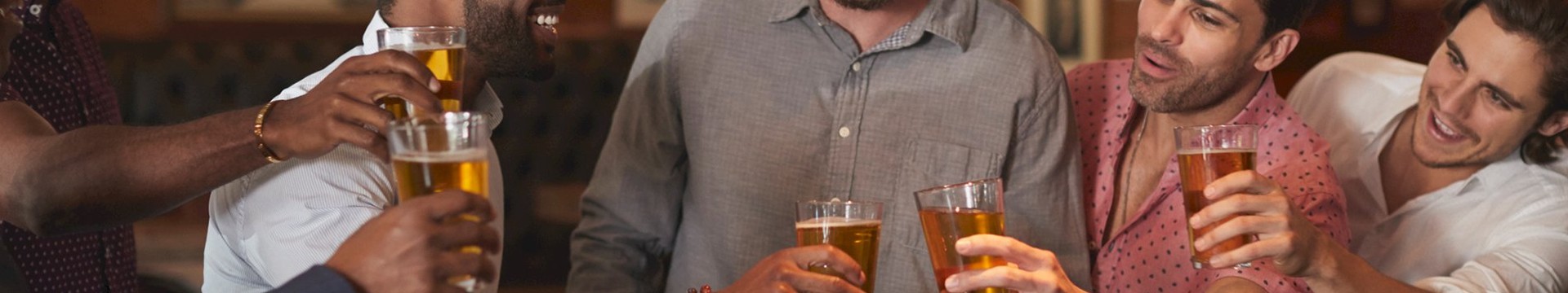 Five men enjoying a beer together