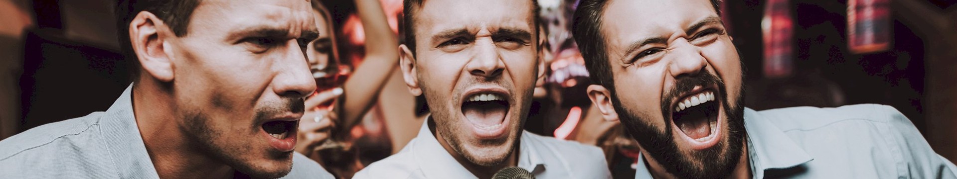 Three men singing on karaoke