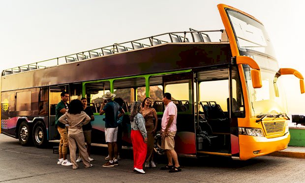 Eight men riding a beer bike
