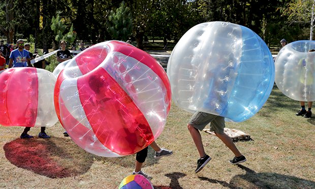 Four people taking part in Bubble football