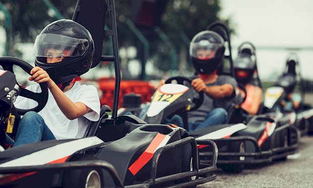 2 people in go karts starting a race