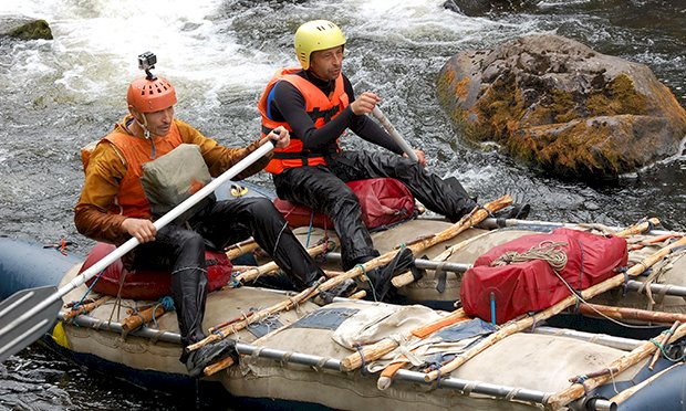 Two men completing raft building