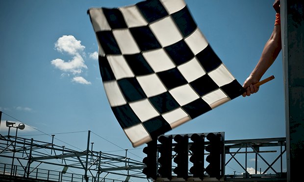 A racing flag being waved 