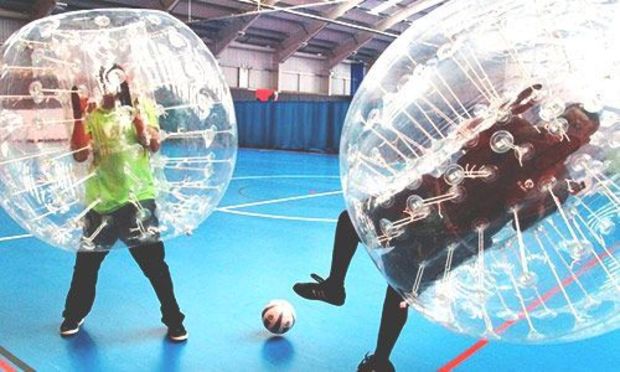 Image of men playing bubble football