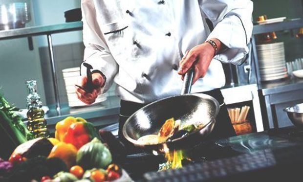 A chef making an evening meal.