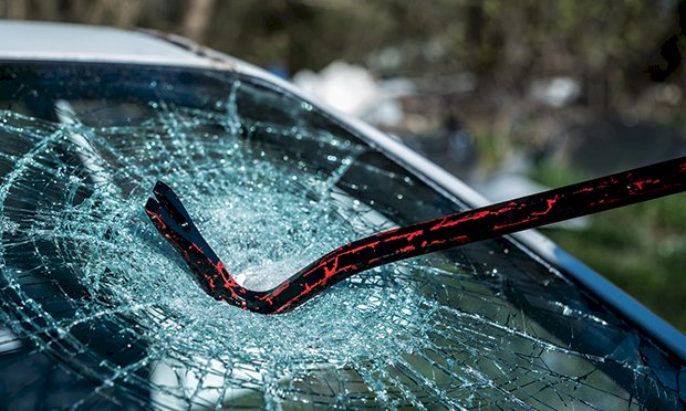 A car being smashed up.
