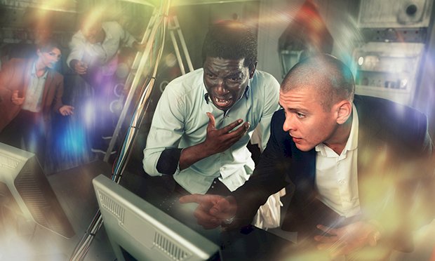 Two men taking part in an escape room.