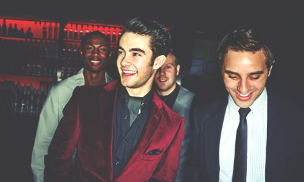 Group from a stag party enjoying the party bus looking dapper in suits.  