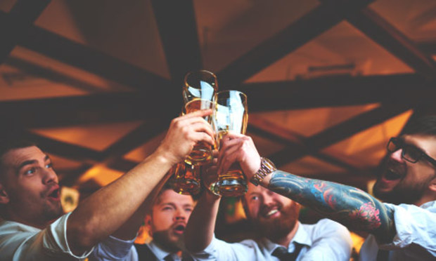 Stag party dressed in shirts and ties raising a pint for the big lad. Discover the Lincoln Pub Treasure Hunt: