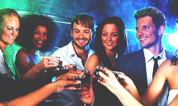 Stag party with girls do Jagermeister shots in a bar.  Discover the Lincoln VIP Bar and Drinks stag party experience: