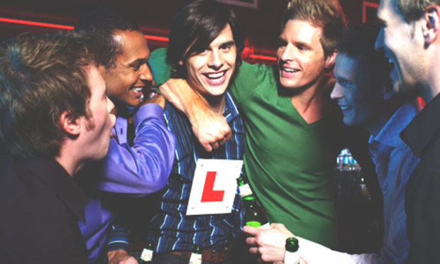 Stag party surrounds the groom with L plates. Discover the Lincoln Walkabout Entry and Drink combo: