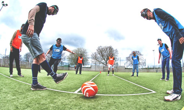 Guys playing football with goggles on 