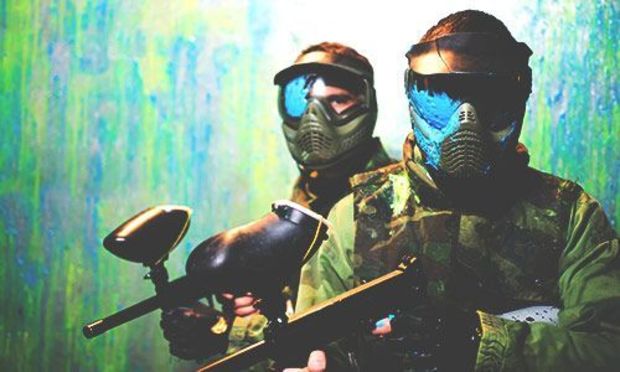 Paintballing in action - stag dressed up in camouflage ready for action  