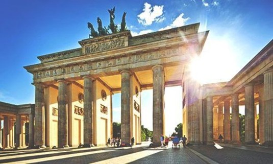 Sun peeping through the Brandenburg Gate. Discover Berlin Stag Party ideas below: