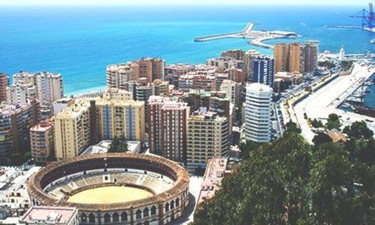 Summer shot over the Paseo del Parque, Plaza de Toros de la Malagueta & the Med. Explore Malaga Stag Party ideas below: