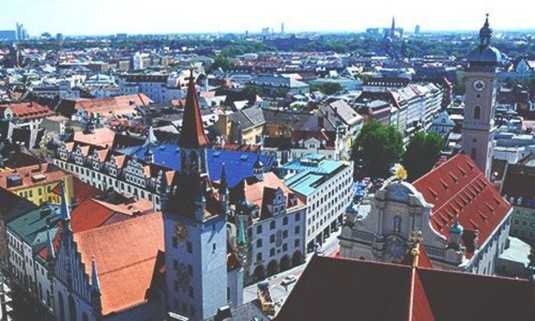 Sun shining on the colourful rooftops of Munich. Explore Munich Stag Party ideas below: