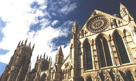 Looking up at York Minster on a sunny day. Discover York Stag Party ideas below: