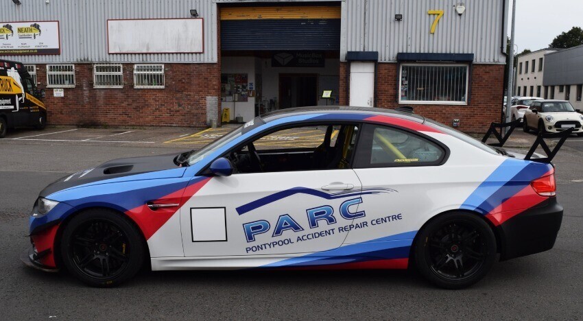 BMW M3 with branded car wrap and vinyl graphics.