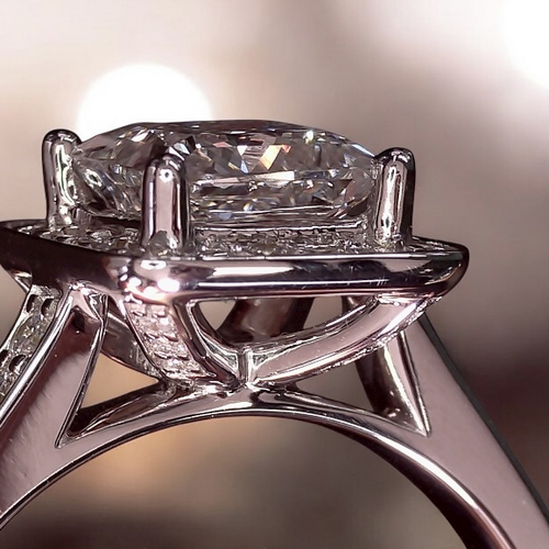 Princess cut halo with diamond set shoulders
