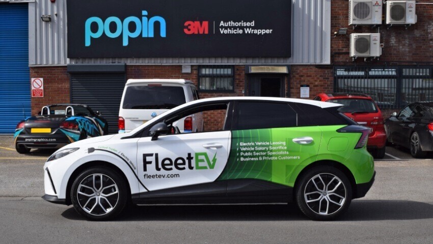 Company owned MG4 Trophy EV car with new vehicle wrap and graphics outside Popin in Cardiff.