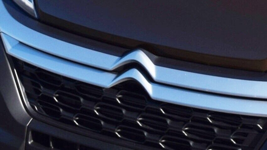 Citroen emblem on front of van.