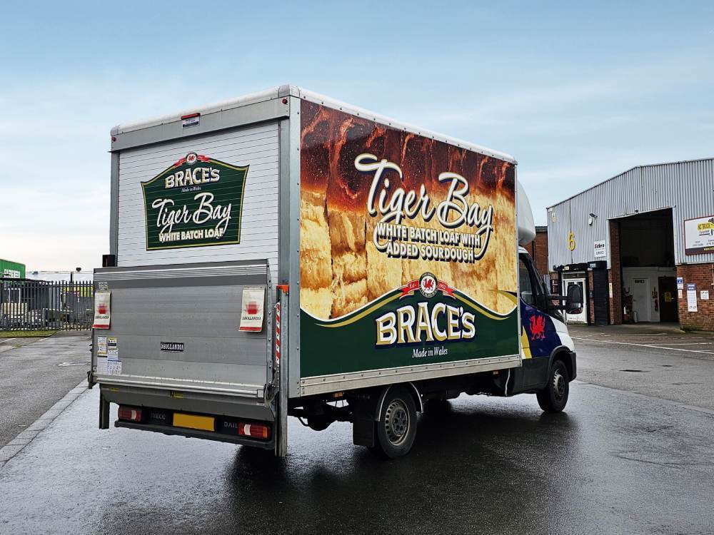 Rear end of Iveco Daily Luton Box van with Brace's Bread company branded vehicle wrap.