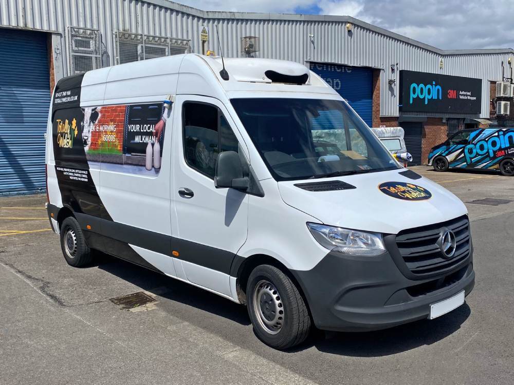 Totally Welsh branded partial van wrap on white Mercedes Sprinter van outside Popin in Cardiff.
