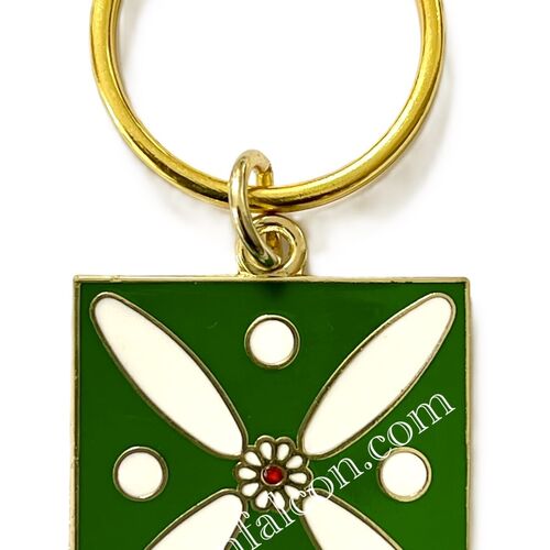 Charm. The Persian Cross. White on Green with 1 Central Red Stone.