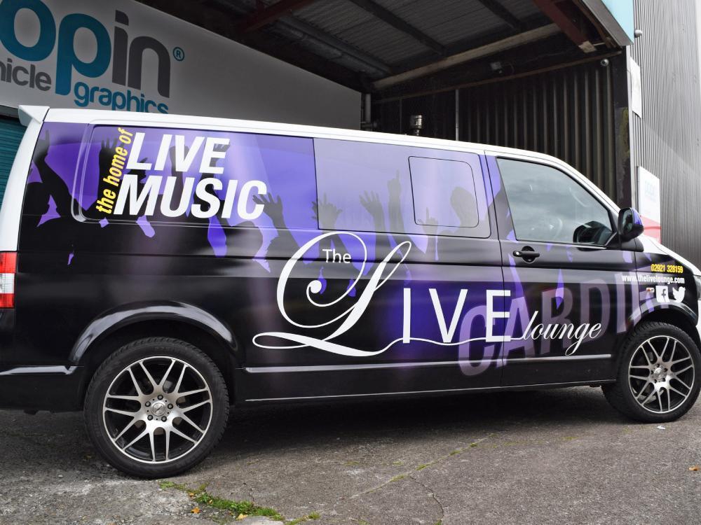 Volkswagen Transporter van with Live Lounge vehicle wrap outside Popin in Cardiff.