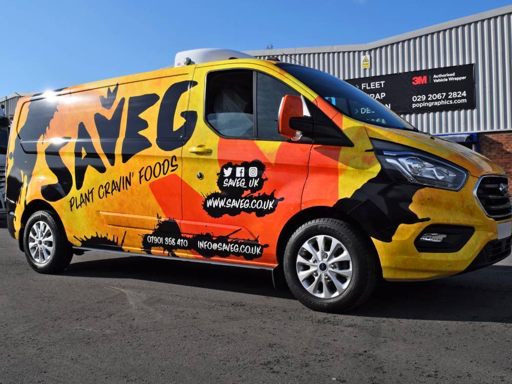 Yellow orange and black company branded vehicle wrap on Ford Transit Custom van.