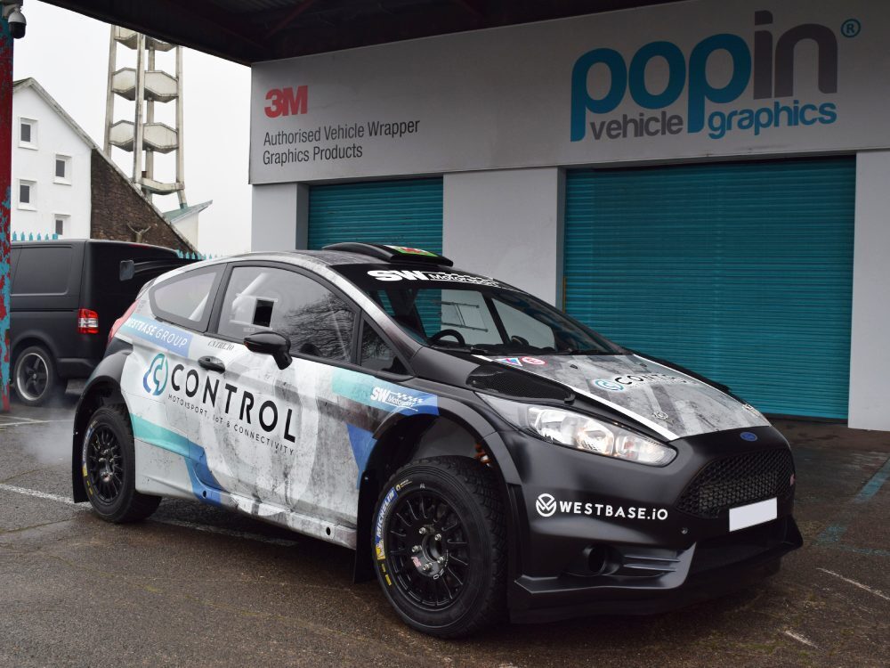 Commercial vehicle livery and graphics on Ford Fiesta R5 company car outside Popin in Cardiff.