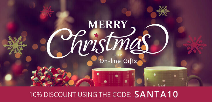 Banner image showing a cozy living room out of focus with two coffee mugs and a gift. In there middle there is a merry christmas message and an offer for 10% off.
