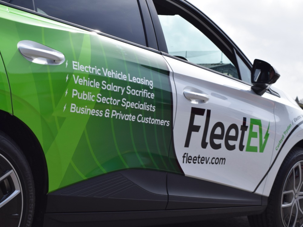 Partial branded company car wrap and graphics on MG4 Trophy EV.