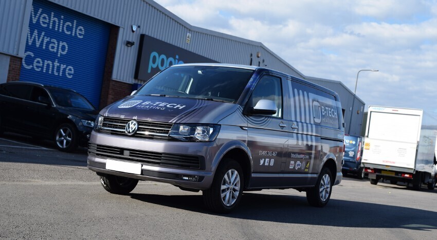 Branded company vehicle graphics on a Volkswagen Transporter parked outside Popin in Cardiff.