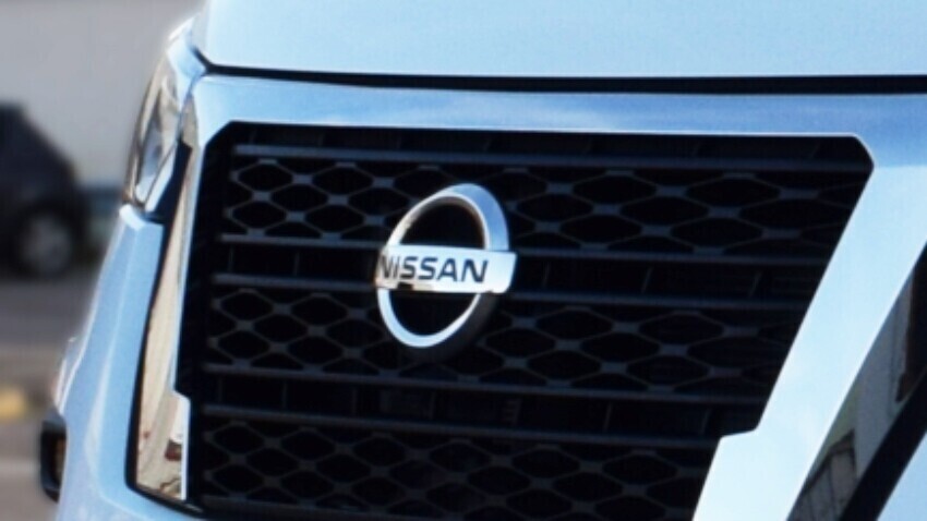 Nissan emblem on a van.