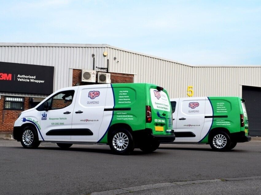 Two company electric vehicles with new liveries and vinyl graphics outside Popin wrap centre in Cardiff.