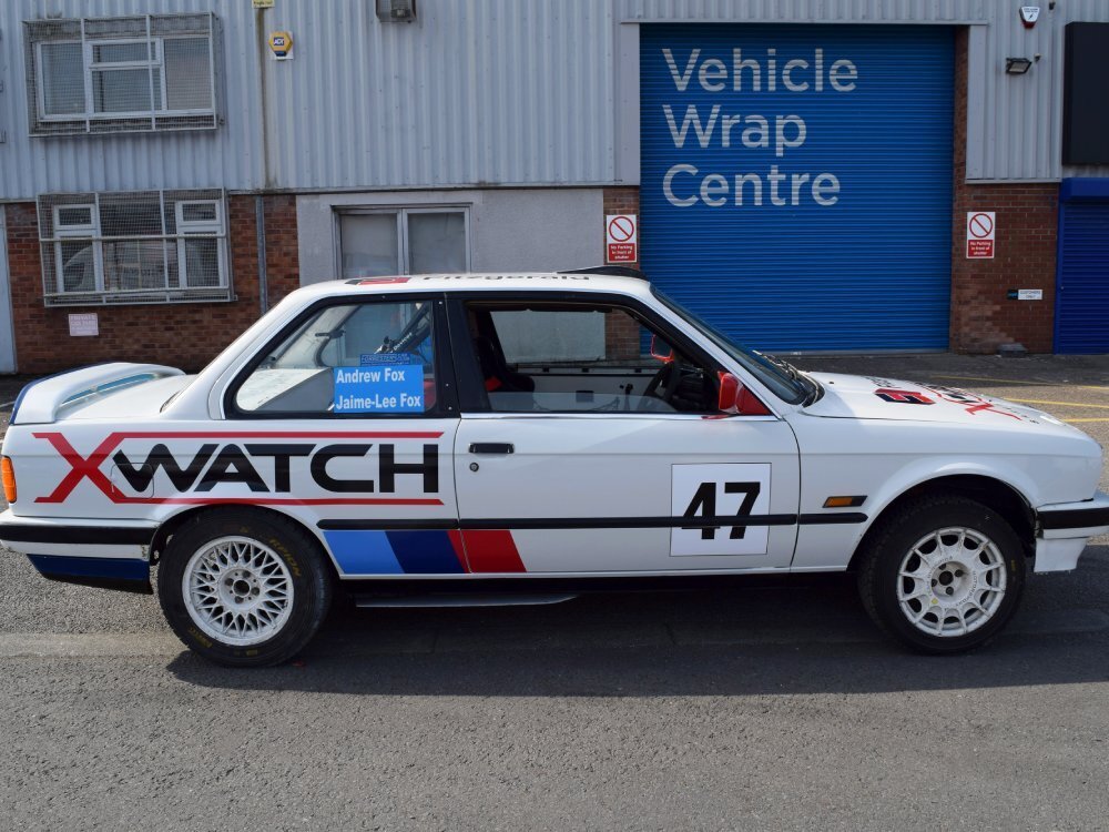 Vibrant graphics on BMW E30 rally race car