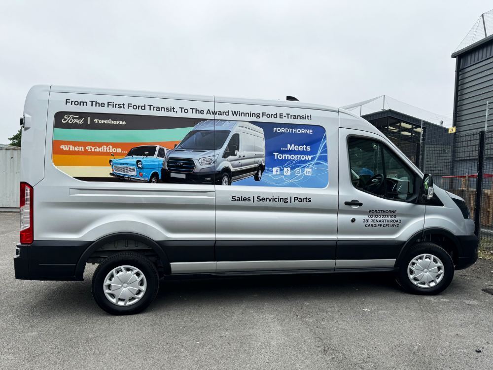 Infilled panel graphics on silver Ford E-Transit company van for Fordthorne.
