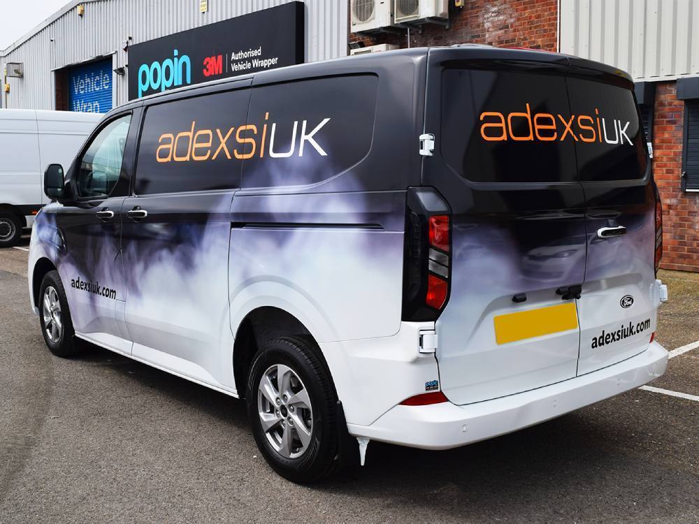 Full vehicle wrap installed on Ford Transit Custom company van.