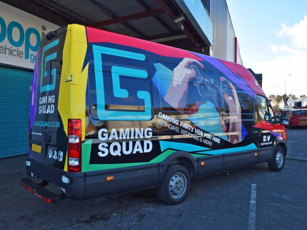 Colourful vehicle wrap for Gaming Squad brand on company Iveco Daily van outside Popin in Cardiff.