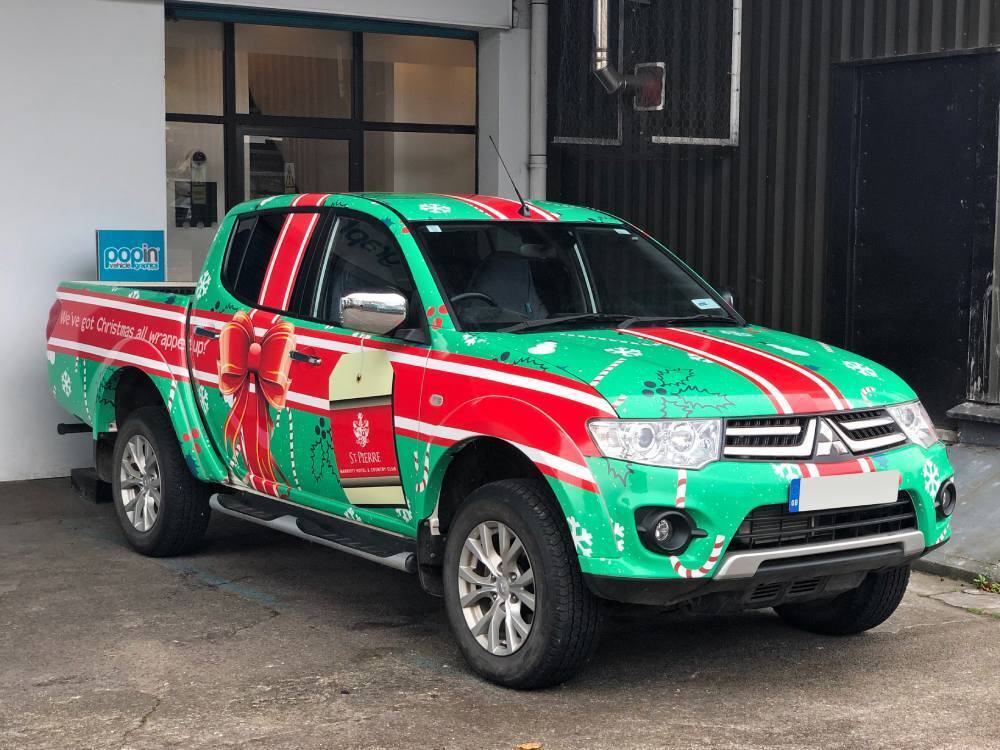 Christmas promotional marketing livery on company owned Mitsubishi L200.