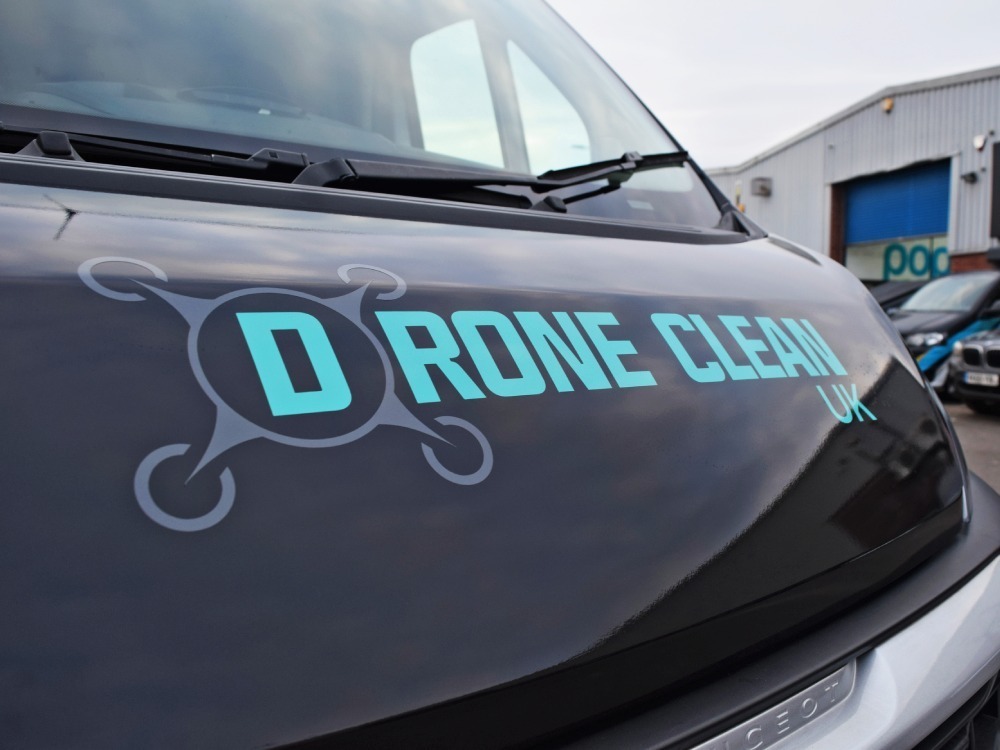 Company branded vinyl graphics on bonnet of Peugeot Boxer van.